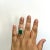 Gorgeous 6.36 ct. green jade oval cabochon with 2.02 ct. white diamond baguettes. Handmade in platinum. Ring size 8.