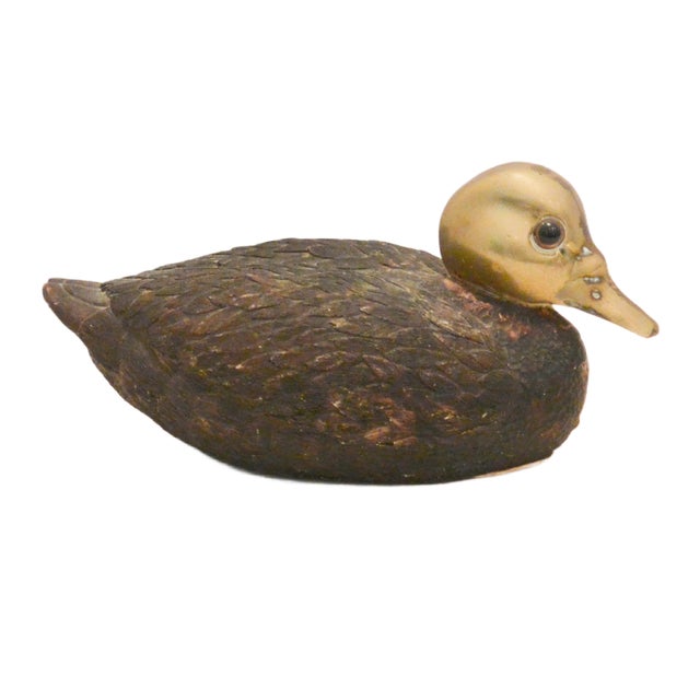 An exceptional piece of late mid-century American sporting folk art. This collectible duck figurine features an expertly...