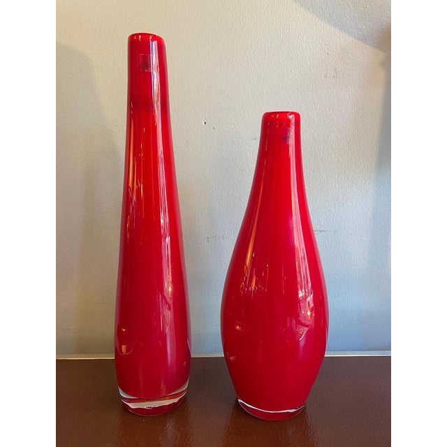 Pair of vases by laveno for richard ginori. Crafted in murano glass using the sommerso technique, they feature layered...