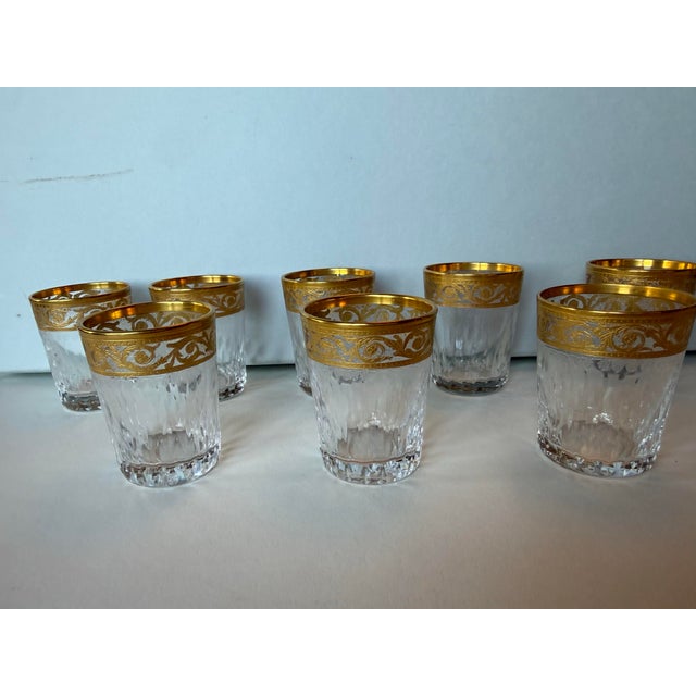 A boxed set of eight Saint-Louis crystal cordial glasses in the maison’s iconic gold-encrusted Thistle pattern, retaining...