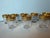 A boxed set of eight Saint-Louis crystal cordial glasses in the maison’s iconic gold-encrusted Thistle pattern, retaining...