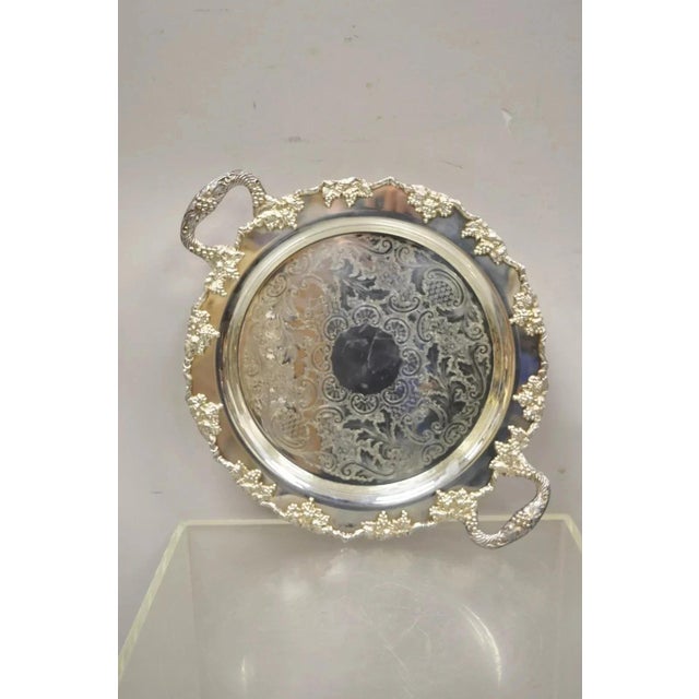 Vintage Crescent Silver Plated 17" Grapevine Pattern Round Bar Tray w/ Handles. Circa Mid 20th Century. Measurements: 2" H...
