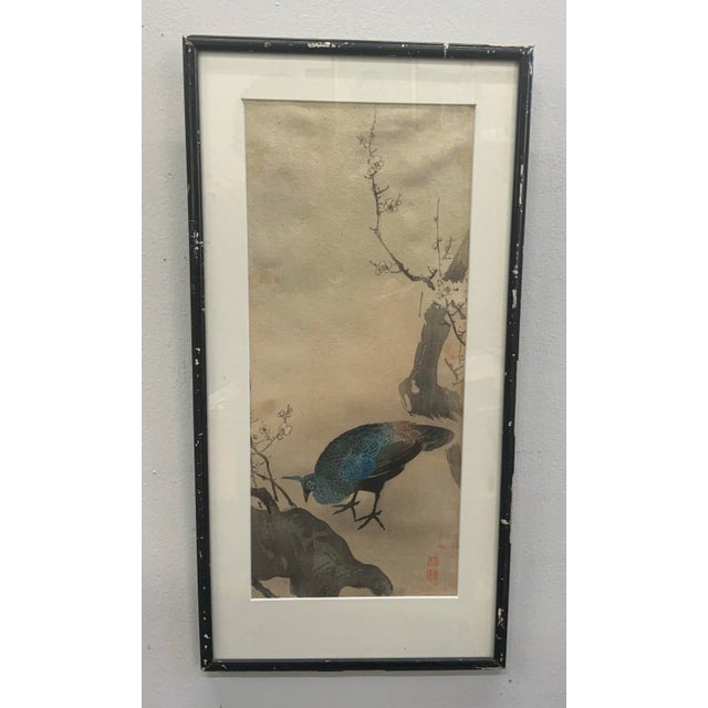 Beautiful vintage Japanese woodblock depicting peacock and apple blossoms.
