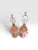 A delightful pair of vintage ceramic table lamps featuring a glossy blush pink glaze and elegant diamond-pattern relief...