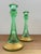 These green ribbed glass candlestick holders feature gold accents and a beautifully detailed stippled base. They are...