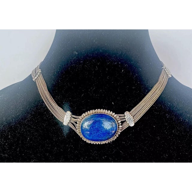 build on this season’s minimalism through feeling and texture with this vintage necklace hand made from silver metal....