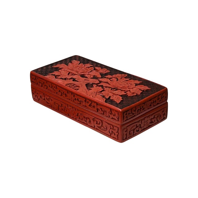 This Chinese Vintage Cinnabar Lacquer Box is a testament to exquisite craftsmanship. The rich, vibrant red lacquer creates...