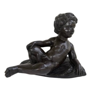 Vintage Bronze Finish Reclining Cherub Sculpture on Textured Base For Sale