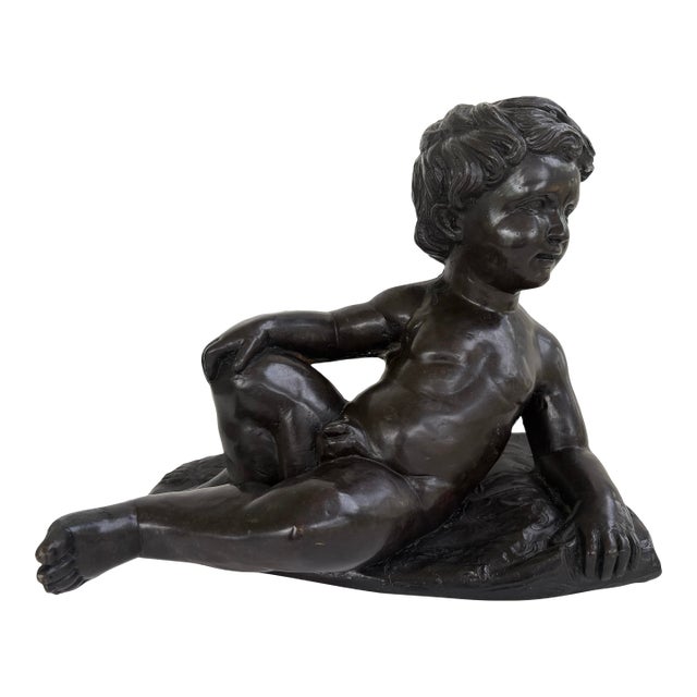 Vintage Bronze Finish Reclining Cherub Sculpture on Textured Base For Sale