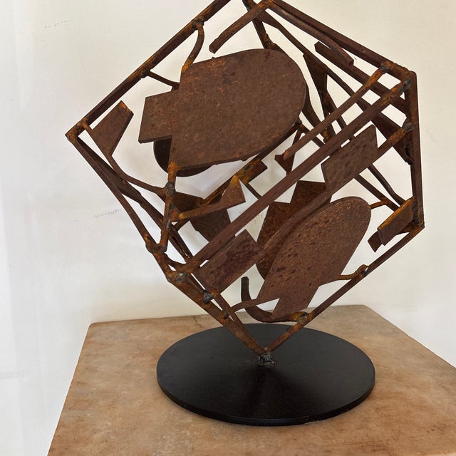 This is a welded scrap steel sculpture on a round iron plate, made by Iowa Sculptor David Owens. The steel came from a...