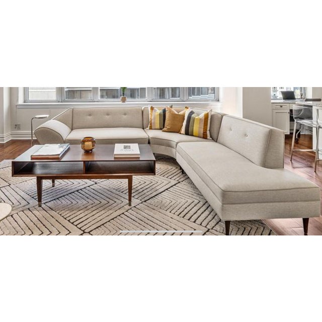 A dramatic curved sectional from the 1960s, sculptural in form and newly reupholstered for today’s spaces. Its sweeping...