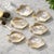 Set of six hand-made, genuine mother‑of‑pearl bowls carved in a stylized fish form, each with luminous natural iridescence...