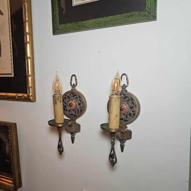 A pair of antique Moe-Bridges wall sconces, crafted in a style characteristic of the company’s early 20th-century designs....