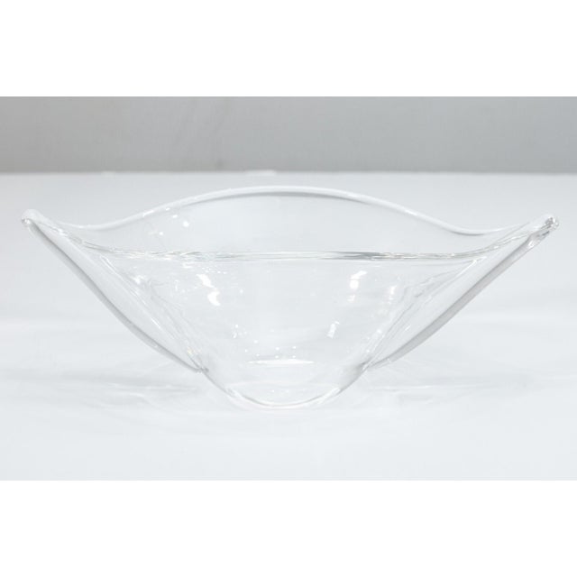 A vintage Steuben crystal glass bowl. This lovely piece of decorative glass features a round boat-shaped design. The oval...