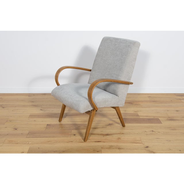 Model 53 armchair was manufactured by Ton in the 1950s to 1960s. They were designed by Jaroslav Smidek. The interior has...
