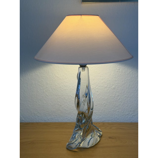 This elegant vintage table lamp base was crafted in the 1960s by the renowned Cristallerie de Lorraine in France. It...