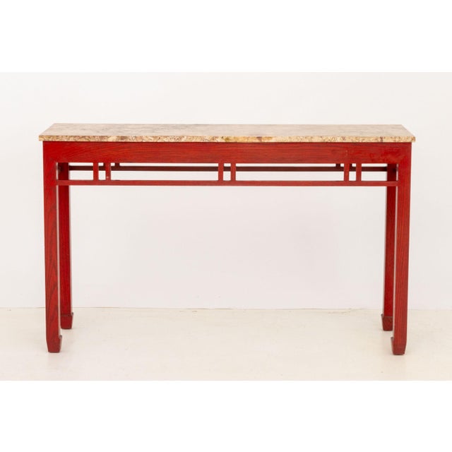 James Mont Style Marble Top Red Stained Oak Console Table. 32" H x 53" W x 15.75" D. Provenance: A Sutton Place Collection.