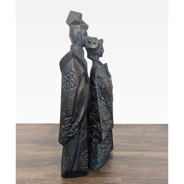 This unique sculpture features a Japanese couple dressed in traditional attire, crafted with fine attention to detail. The...