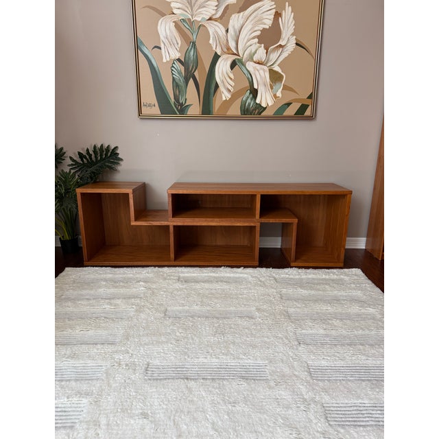 Vintage 1980s Danish "Puzzle Piece" Sliding Credenza / Console A very gorgeous Danish teak console table, featuring two...