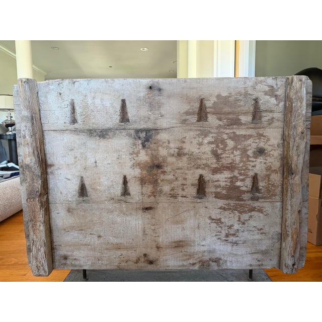 A rare and striking example of traditional Indian artisan craft — a hand-carved wood mold panel used to press intricate...