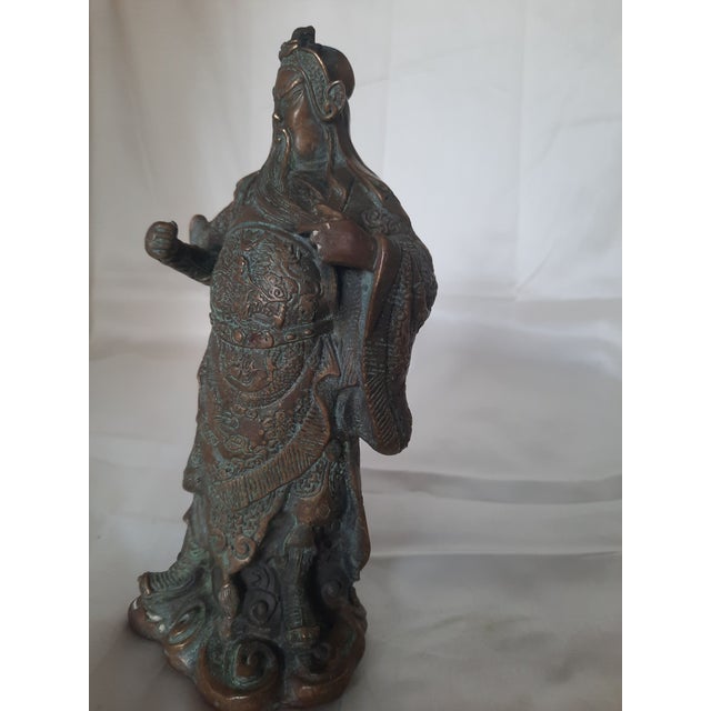 Add a striking piece of traditional Asian artistry and symbolism to your collection with this finely cast bronze sculpture...