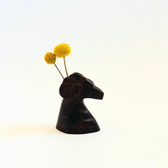 A vintage carved ironwood ram bud vase. Great detailing to the animal's features with a lovely dark natural grain and...