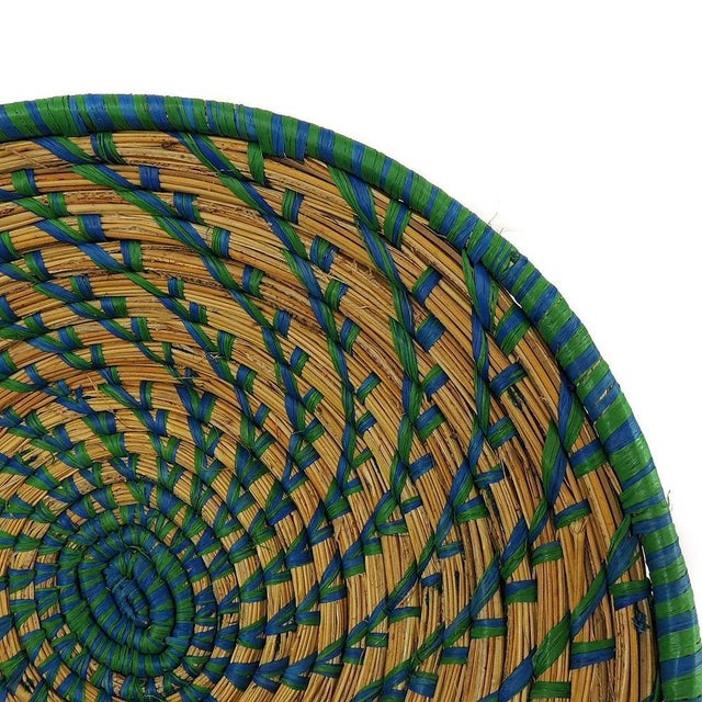 An open, coiled basket made from papyrus plants.Â The art of making baskets has become one of the most lucrative...
