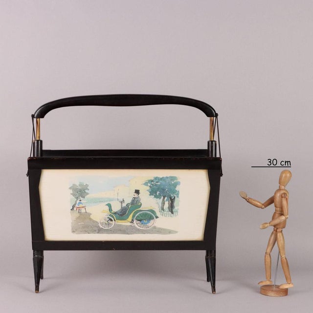 Magazine rack, with decorative watercolour designs with transparent glass, on the sides, ebony stained wood, brass. Good...