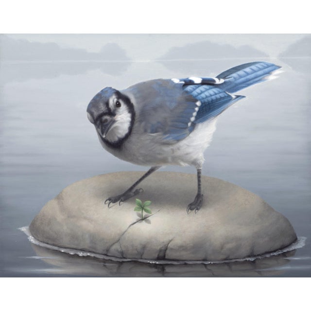 "Blue Jay" is an oil on panel painting by Susan McDonnell, completed in 2021. A blue jay stands on a rounded, pale rock...