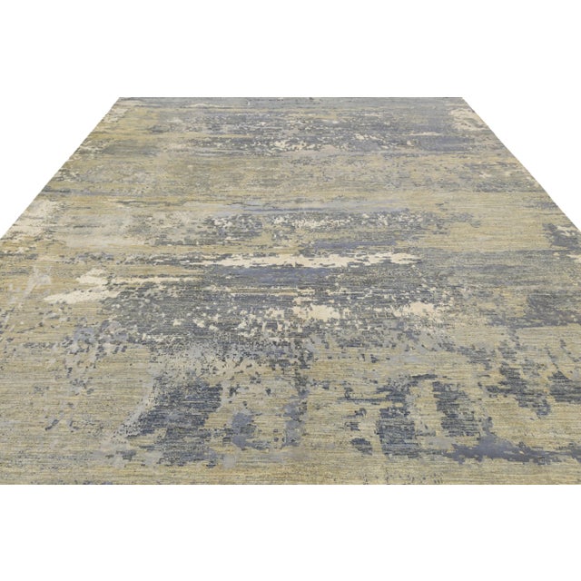 This contemporary hand-knotted rug features a stunning design with a vibrant color scheme. Made from high-quality wool or...