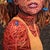 Oasis by Ifeoluwa Alade | Acrylic and glow in the dark medium on canvas portrait of a woman with floral elements. For Sale - Image 4 of 5