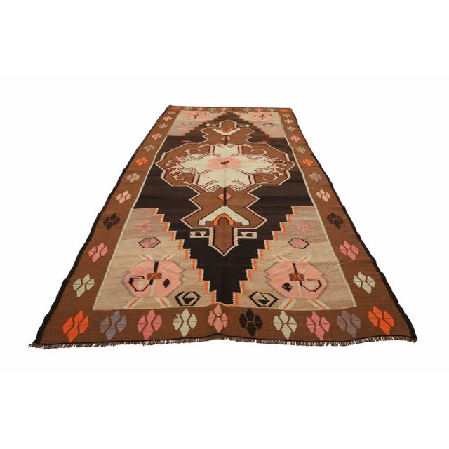 Vintage handwoven decorative kilim rug from Kars region of Turkey. Approximately 50-60 years old. In very good condition.