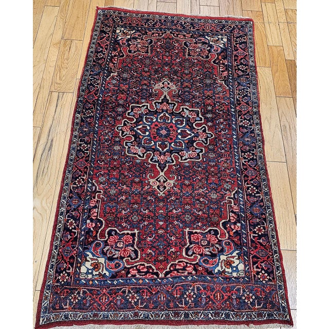 "This distinguished vintage Persian Bidjar rug, woven in the early 1900s, is a superb example of the artistry and enduring...