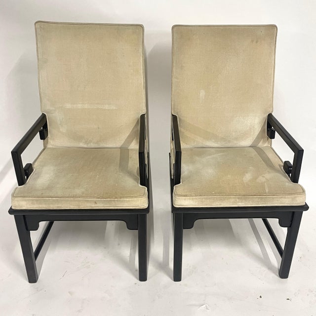 Elegant and sturdy pair of midcentury Chinoiserie styled chairs in the manner of Michael Taylor. These solid ebonized wood...