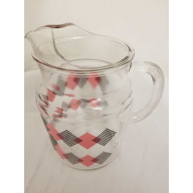 Cute and kitschy vintage pink and black domino glass pitcher. Made by Hazel Atlas, you can't help but to fall in love with...