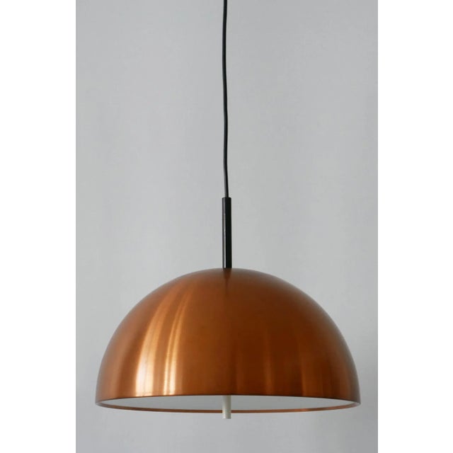 Minimalistic Mid-Century Modern copper pendant lamp or hanging light. Designed and manufactured by Staff & Schwarz...