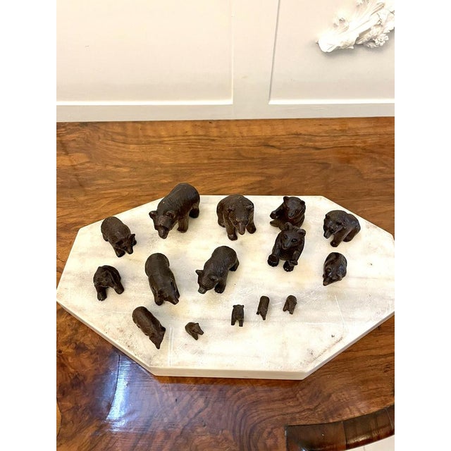 Antique set of fifteen 19th century miniature carved black forest bears some standing, some sitting down, some with...