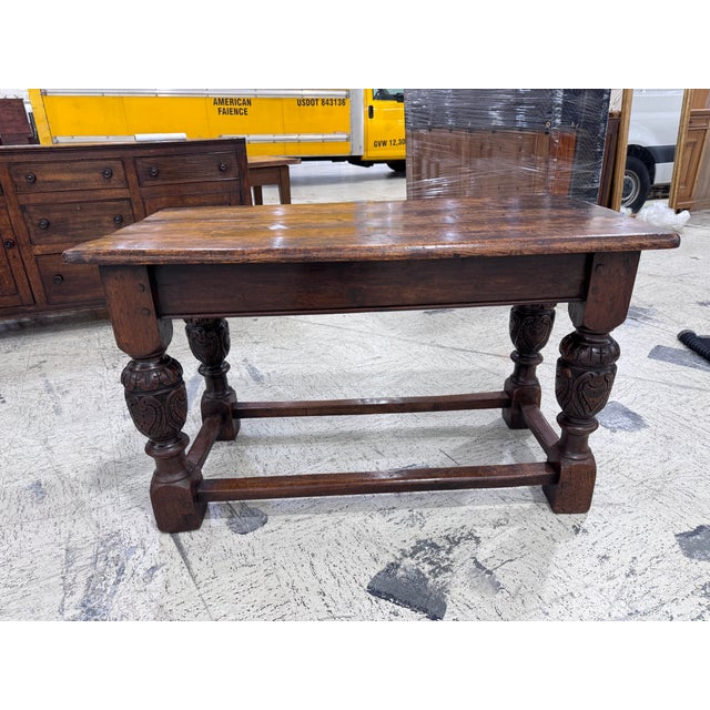This is a dark 18th Century Refractory Table in Jacobean style. It features bulbous carved legs and thick plank top in a...