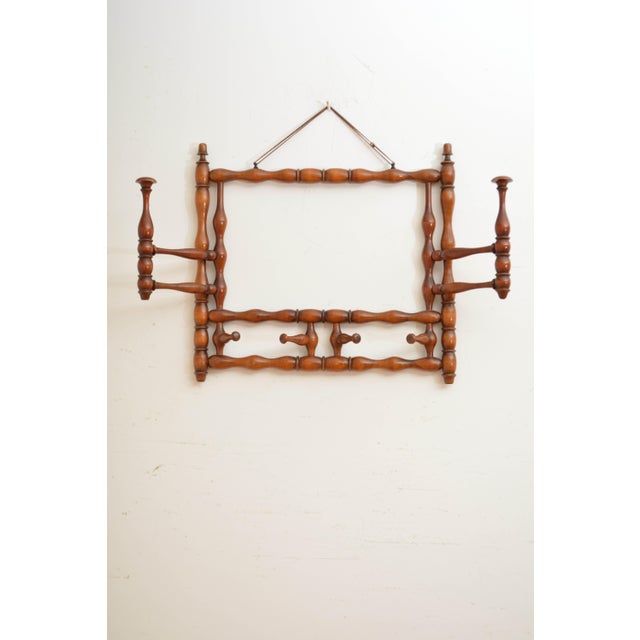 A stylish and very attractive french large bobbin-turned coat and hat rack, featuring two large and four small swivelling...