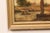 A European riverside village landscape oil painting, in gilt frame, from the 19th century. This antique painting from...