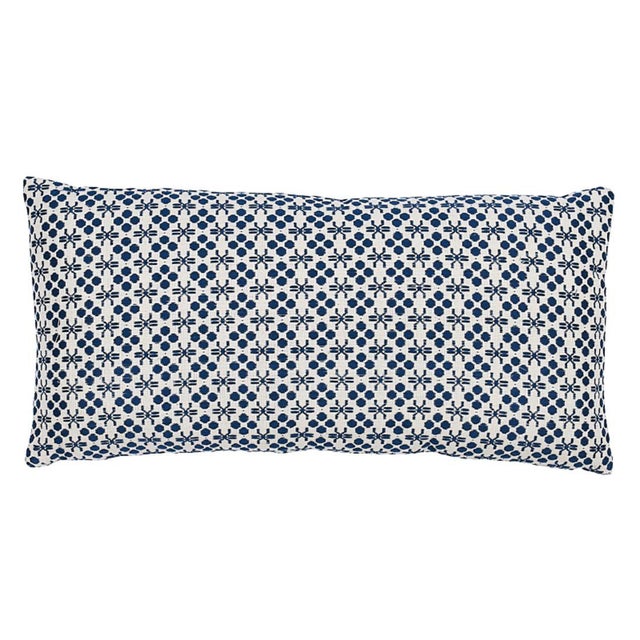 This pillow features Poxte on the front and Lempa on the back, both by A Rum Fellow for Schumacher with a knife edge...