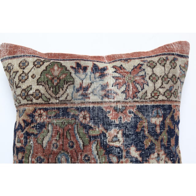 This striking pillow cover is crafted from a vintage hand-knotted tribal rug, bringing authentic Old World character into...
