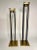 There's a streamline and classic look to this pair of contemporary modern candlesticks. Four small black metal cylinders...