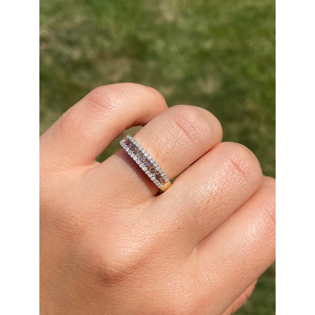 The Frink: Brown and White Diamond Stackable Band in Yellow Gold. The band features a center channel set row of browne...