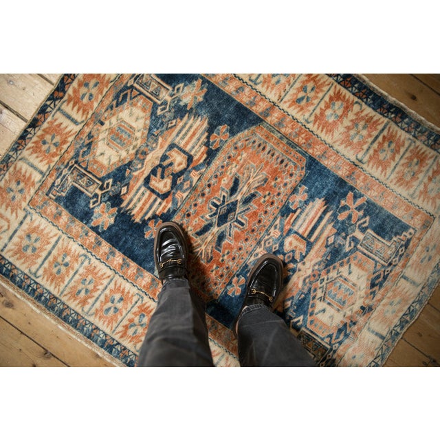 Single oversized center medallion in gul stylized relief with geometric minor serrated medallion therein. Colorful...