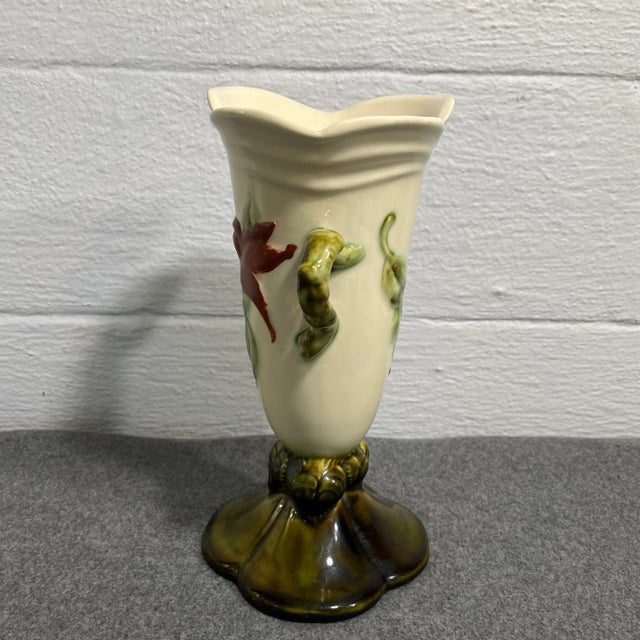 Cream colored body with an earthy green base and dual green handles in a branch style design. Nice glossy finish.