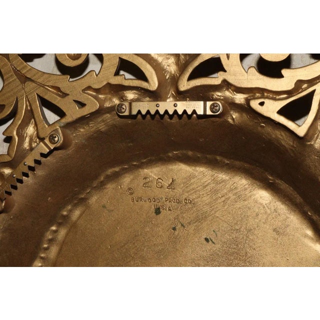 1960's Hollywood Regency wall clock by Burwood, it's 15 inches square in gilt gold with new battery movement. Runs great...