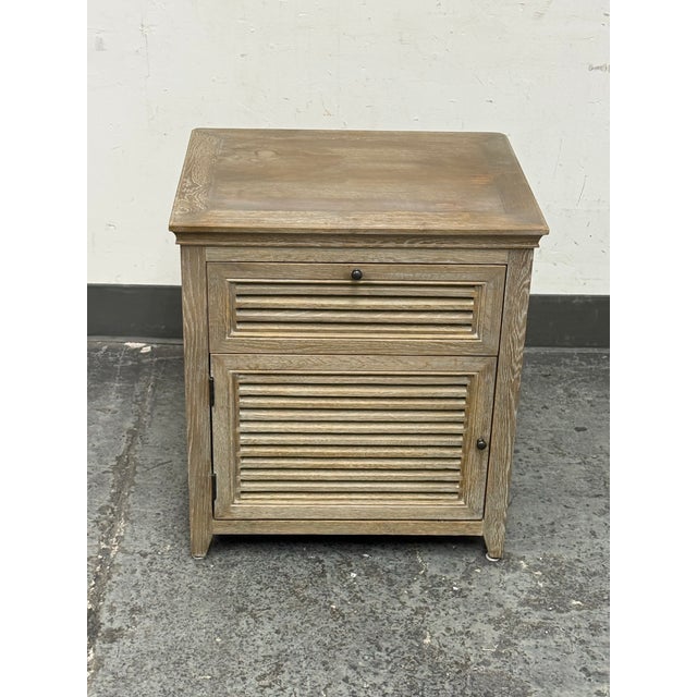 Design Plus Gallery presents the Shutter Nightstand from Restoration Hardware. The piece has a light washed wood tone with...