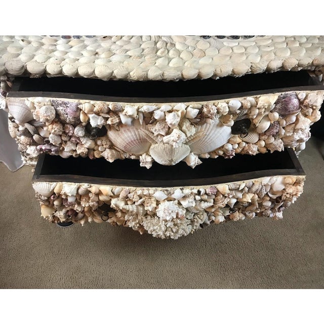 Immerse your space in the captivating allure of the ocean with this exquisite vintage coastal commode. Crafted in the...