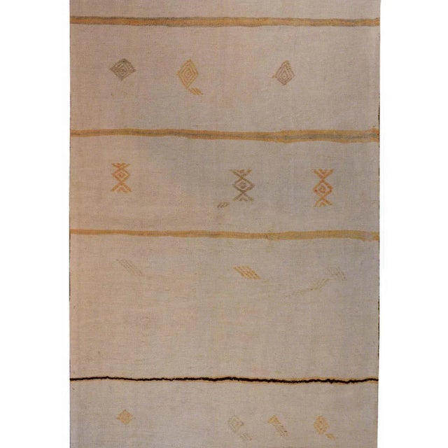 A wonderful vintage Anatolian Turkish Kilim rug with alternating pale pink and green stripes and embroidered geometric...